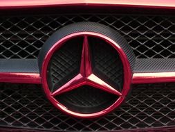 Mercedes star by car