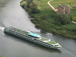 passenger ship on mosel river in view of stuben monastery, germany
