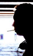 Silhouette of a lonely man on the street