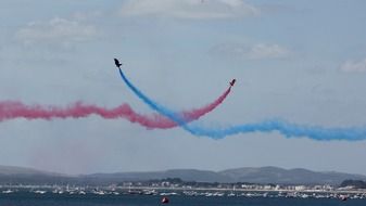 airplanes with multi-colored smoke