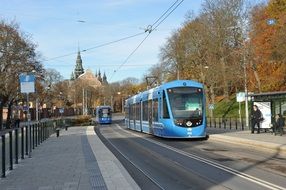 blue modern tram in the city