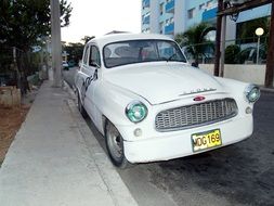 white retro car on the street in cuba