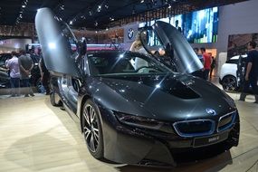 new luxury bmw car with open doors on auto show