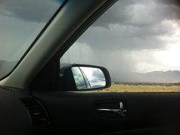 view of the rain clouds from the car