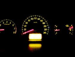 illuminated speedometer on a dashboard