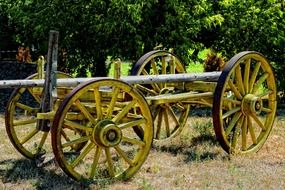 wooden cart with yellow wheels