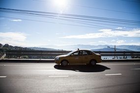 taxi on the road in the sunlight