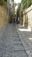 paved street between the houses