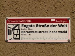 sign about spreuerhofstraÃe as the narrowest street in the world, Germany, Reutlingen