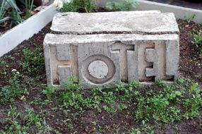 Stone "Hotel" sign