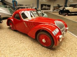 red luxury vintage car in a museum