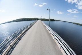 fisheye shot, road bridge above water at summer, finland