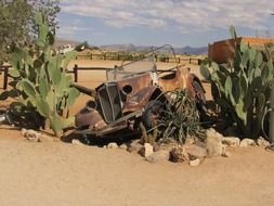 rusty car in the desert in Namibia