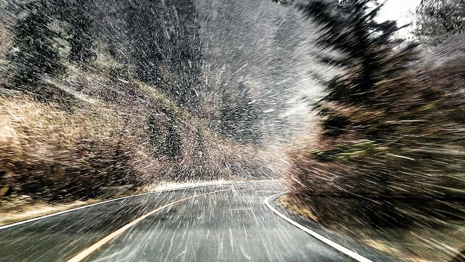 Heavy snow on the road in winter
