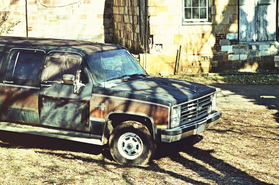 old chevrolet in the yard on a sunny day
