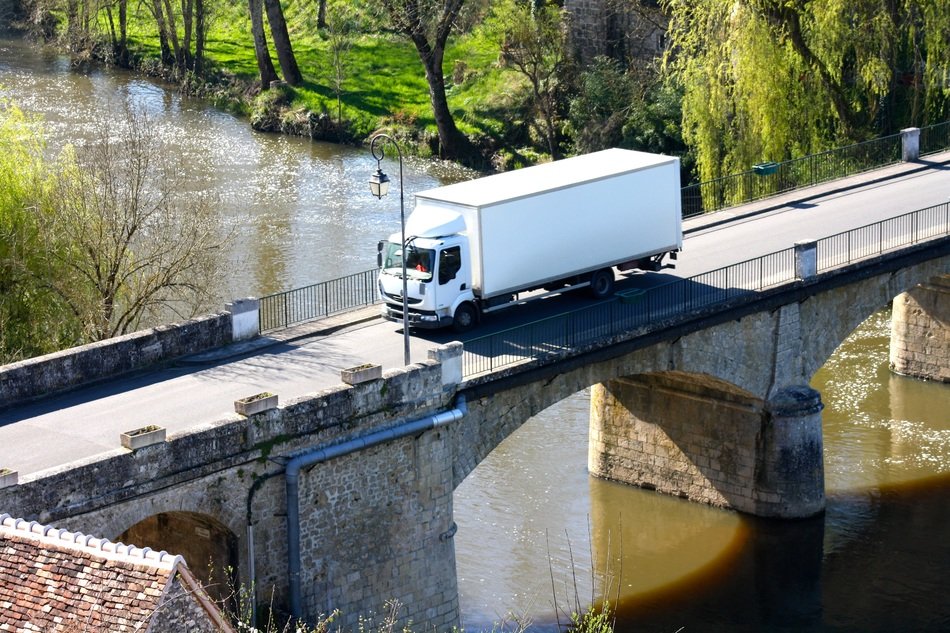truck on the bridge over the river