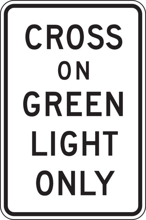 Cross on green light only roadsign