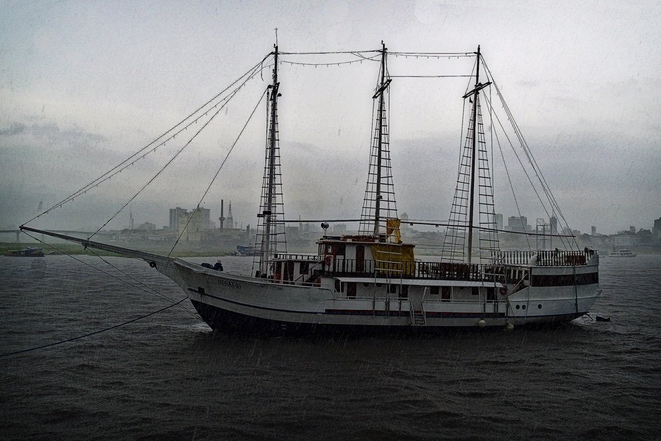 boat on the water during the rain
