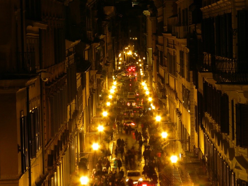 street with lights at night in rome
