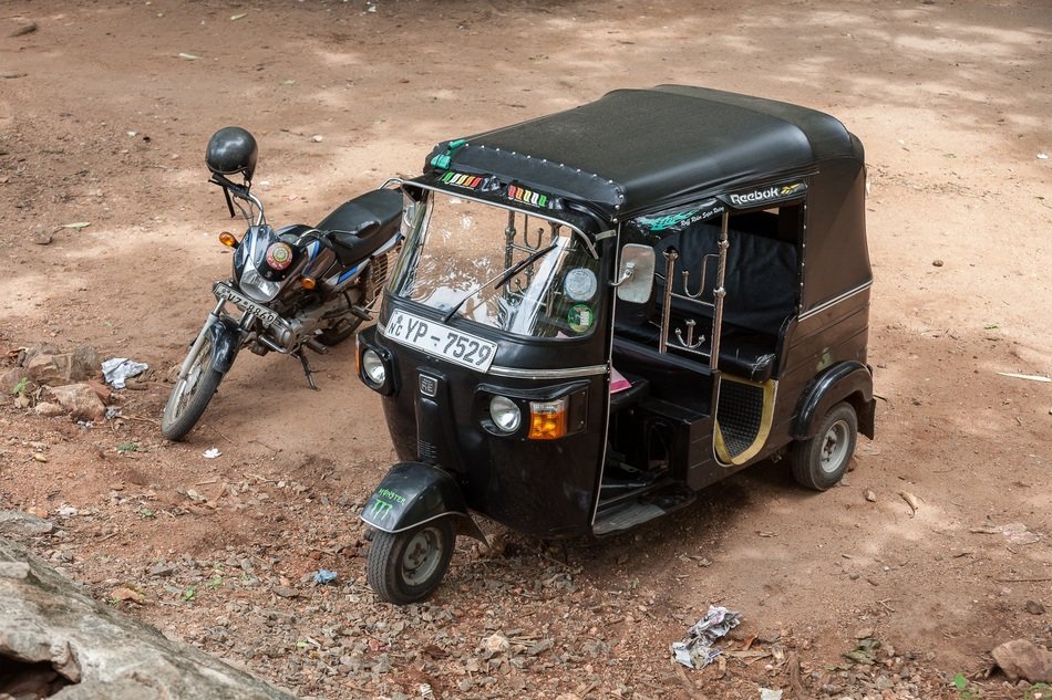 black tricycle and motorcycle