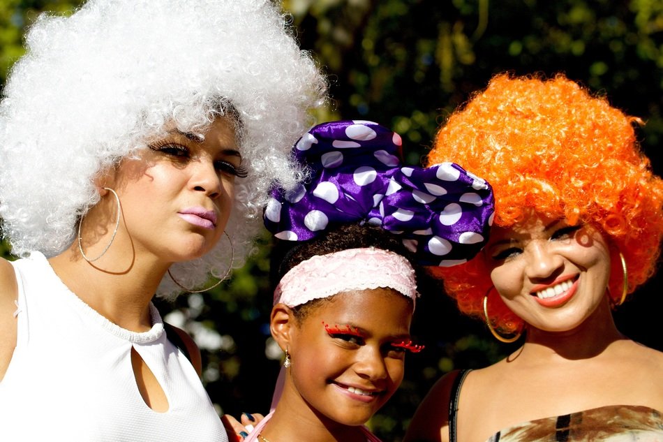 women in wigs at the parade