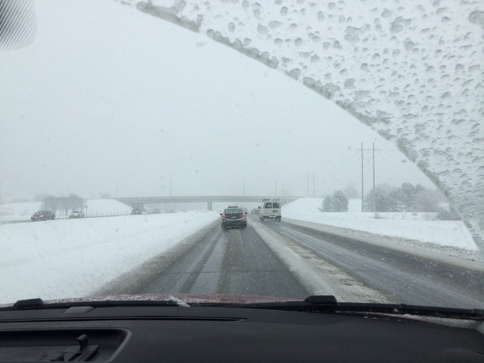 view from the window of the car on the snowy road
