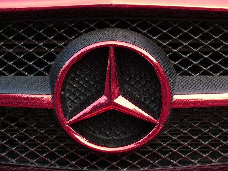 Mercedes star by car