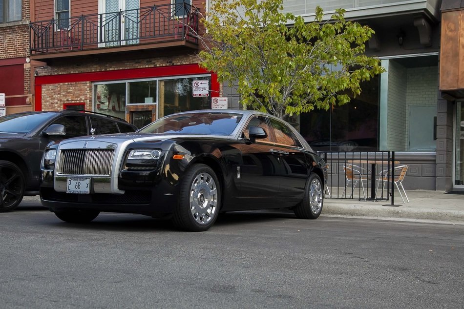 Rolls Royce is in the parking lot