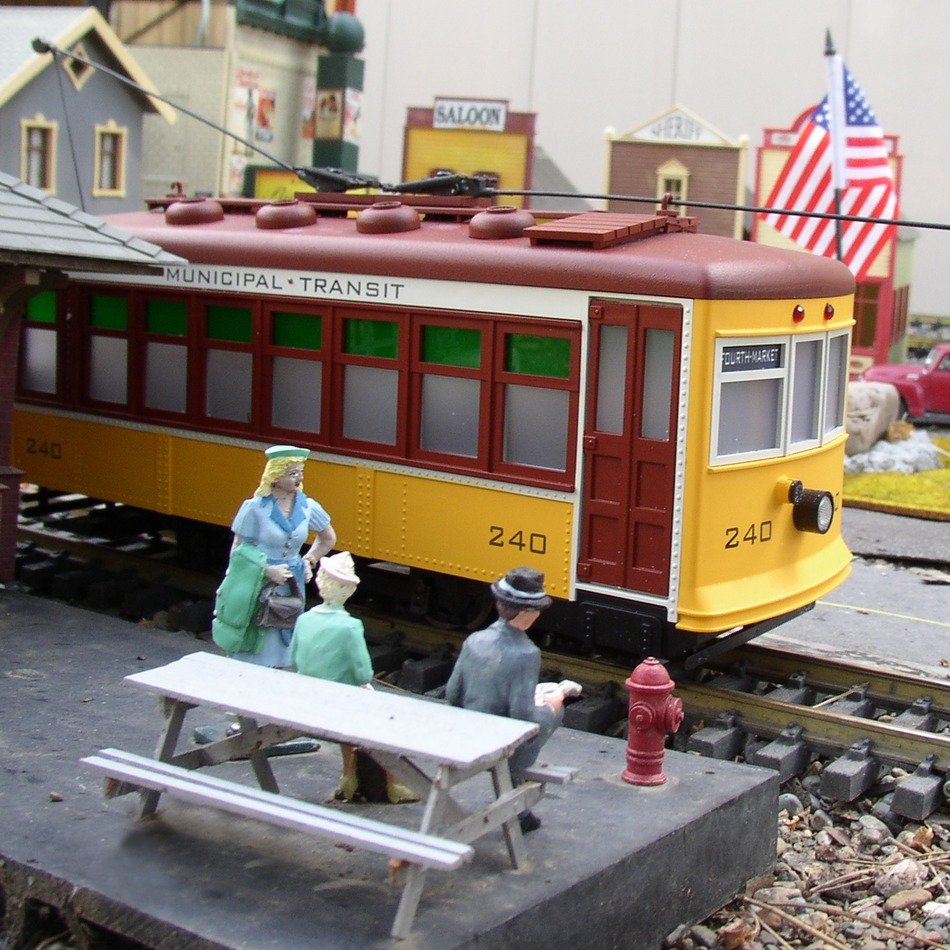 People on the platform on the toy railroad