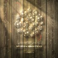 Bright Christmas bauble on light Wooden background