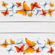 Red and white butterflies on wooden background