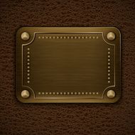 Metal badge on brown leather background N2