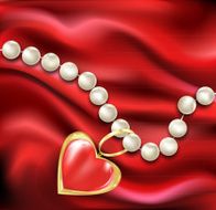 white pearl necklace on a red silk