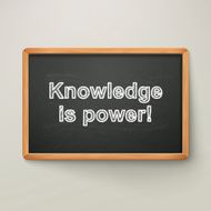 knowledge is power on blackboard in wooden frame N2