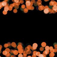 blurred orange dots on black background