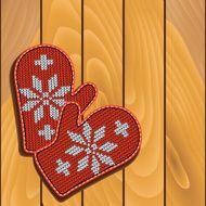Mittens on wooden background