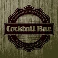 Vintage Cocktail Bar Label on Aged Wood