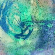 Paint splatters on an abstract watercolor painting