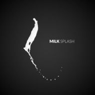 Milk splash isolated on black background N5