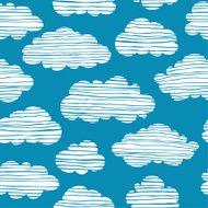 Abstract seamless doodle pattern with white clouds on blue sky