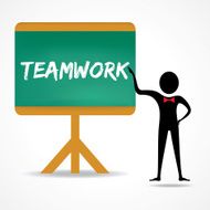Man points to teamwork word on green board