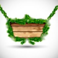 Wooden board with fir branches