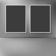 Two blank frames on the wall with abstract blurred backg