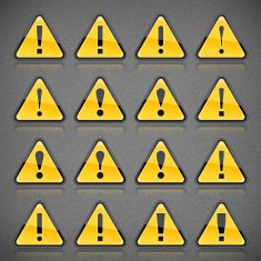 Yellow attention sign exclamation point on gray noise background