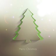 Paper Christmas Tree on blurred and bright Background