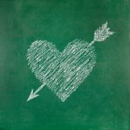 Heart shape with arrow on blackboard N2