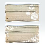 Old wooden sign with snow baubles and snowflakes