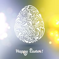 Floral Easter egg made of doodle pattern on blurred b