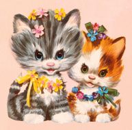 Two Kittens Wearing Flowers