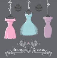 Three short bridesmaid dresses hang on ribbons N2